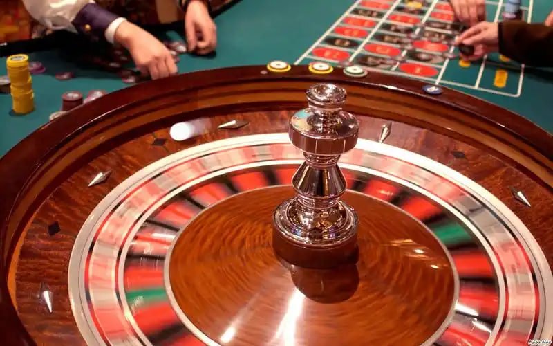 Blackjack table with dealer hand and member betting spots